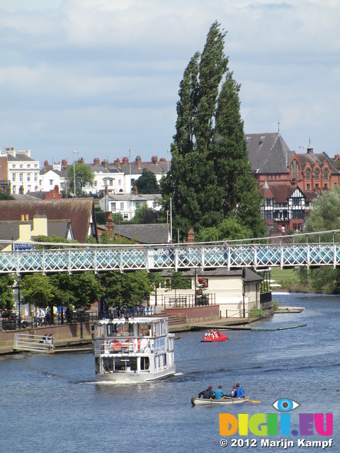 SX23065 Boat passing beneath footbridge on river Dee